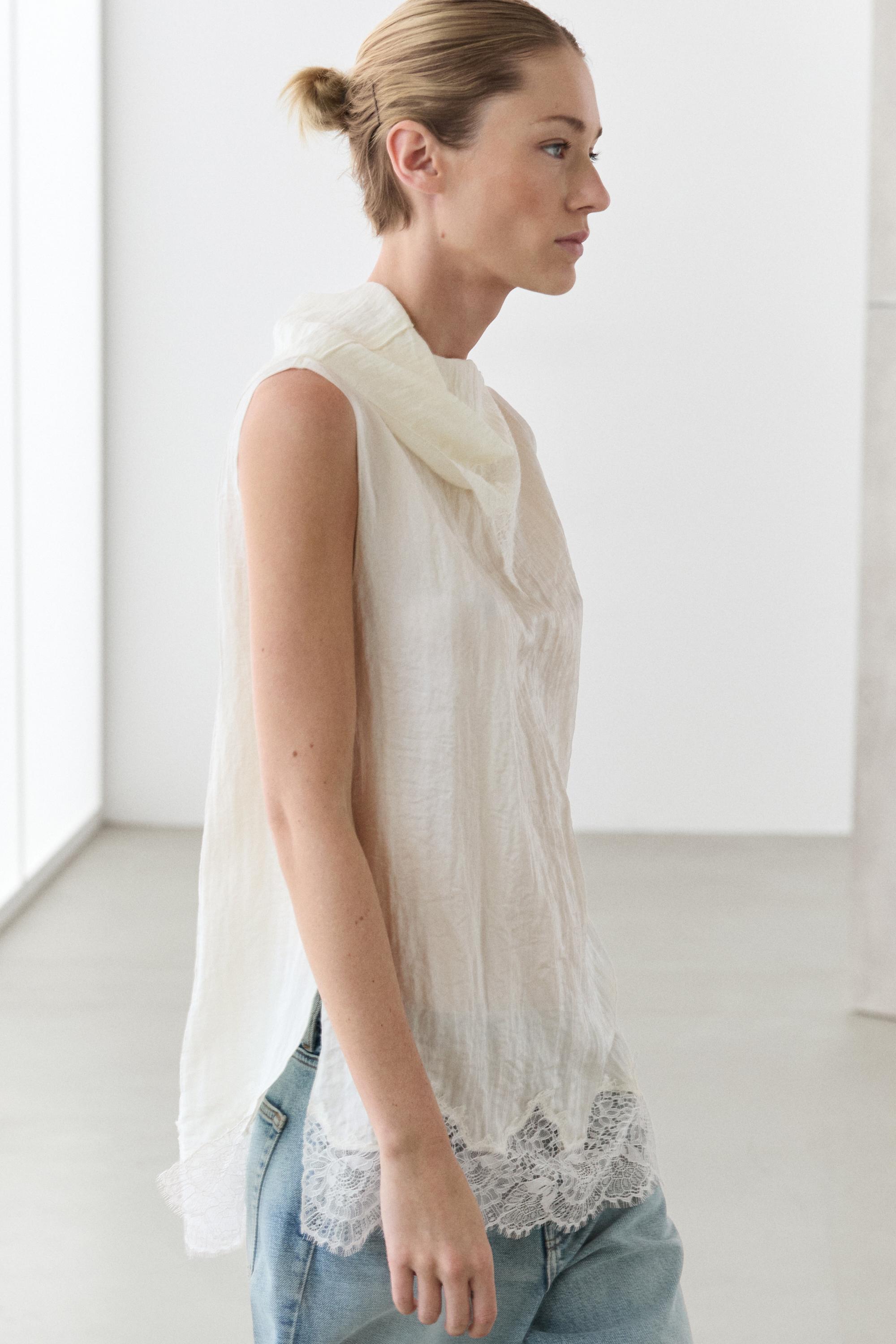 Asymmetric roll neck top with lace detail